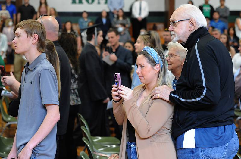 People watch as the graduates march into the gym Sunday, May 22, 2022, during the Alden-Hebron High School commencement ceremony in Hebron.