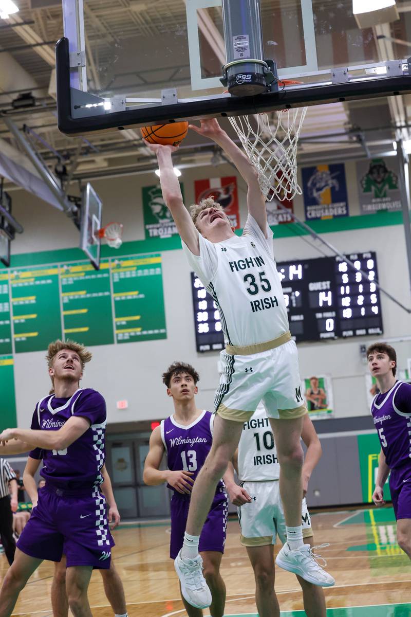 Bishop McNamara's Richard Darr brings a rebound back to the hoop during the Fightin' Irish's 61-24 victory over Wilmington in the IHSA Class 2A Seneca Sectional semifinal on Tuesday, March 3, 2026.