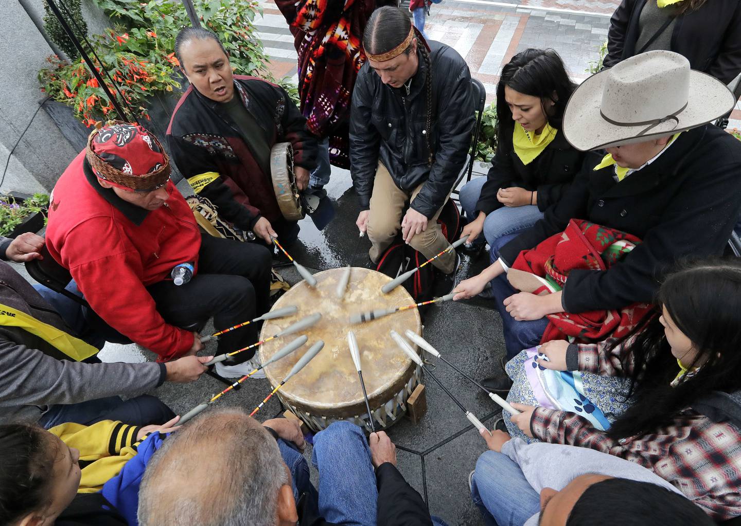 Native Americans and First Nations people join in on a drum circle during an Indigenous Peoples Day blessing and rally before a march Monday, Oct. 8, 2018, in Seattle. In 2014, the Seattle City Council voted to stop recognizing Columbus Day and instead turned the second Monday in October into a day of recognition of Native American cultures and peoples.