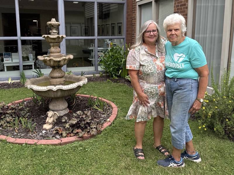 Illinois Extension Master Gardener, Gay Kyle, receives state award. Bettyann Harris (left), Master Gardener and Master Naturalist program coordinator, and Gay Kyle (right) pose together at the Freedom House garden in Princeton.