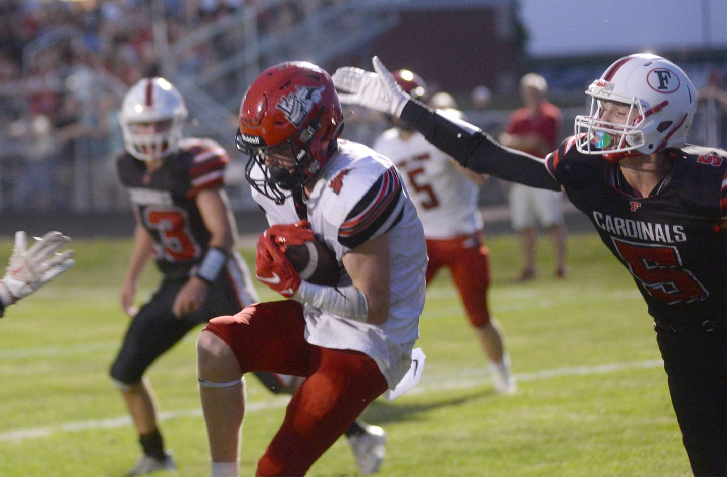 Fulton's Tervor Tiesman (1) catches a pass in the end zone during a Friday, Aug. 25, 2023 game against Forreston.