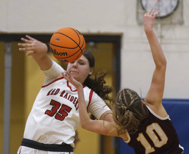 Huntley's Paula Strzelecki blocks the shot of Loyola Academy's Clare Weasler during the IHSA Class 4A Gurnee Warren Supersectional girls basketball game on Monday, March 3, 2025, at Warren Township High School in Gurnee.