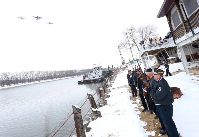 A TBM and a pair of T-6 Texans fly over during the 46th annual Peal Harbor parade and Memorial service at the South Shore Boat Club in Peru.
