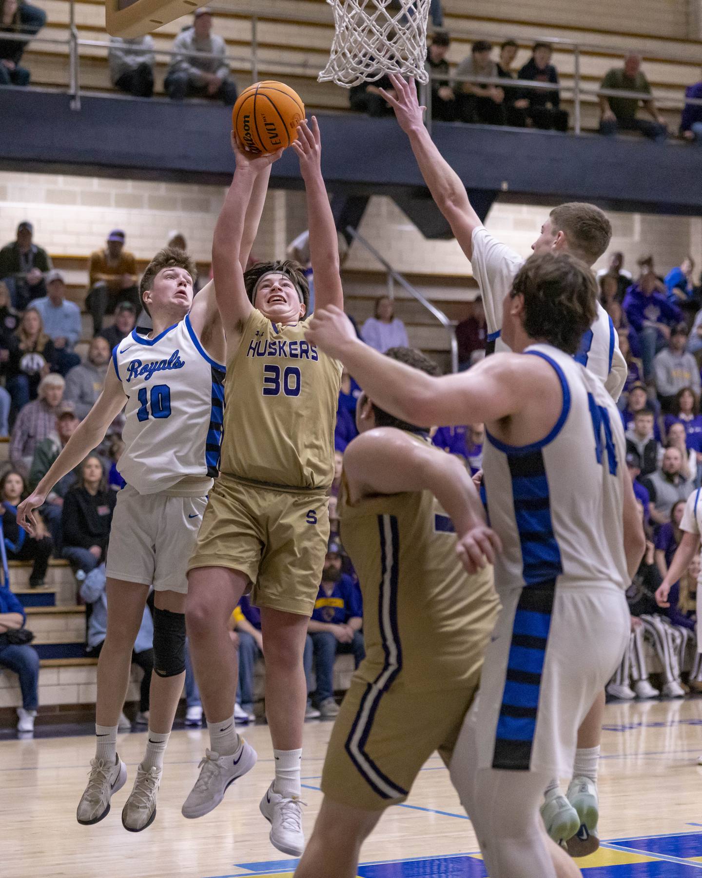 Cash Raikes of Serena High School puts up a shot against Max Hintzsche of Hinckley-Big Rock during the Class 1A Regional Championship on February 28, 2025 at Bader Gym.