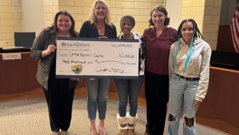 Proceeds from the Montgomery River Run are presented to CASA of Kendall County at the Novv. 24, 2025, Montgomery board meeting. Pictured, Emma Saltzman of Montgomery Place Apartments, Heidi Baird executive director of CASA of Kendall County, Shazette De Leon executive assistant of CASA of Kendall County. Also pictured, Rosie Boeing community engagement and event coordinator for Montgomery, and Paige De Leon volunteer for CASA of Kendall County.