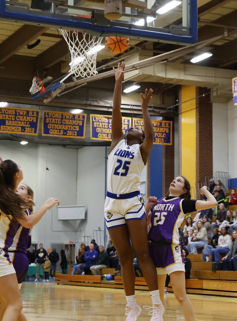 Lyons' Nora Ezike (25) puts up a shot during the girls varsity basketball game between Downers Grove North and Lyons Township on Saturday, Jan. 11, 2025 in La Grange.
