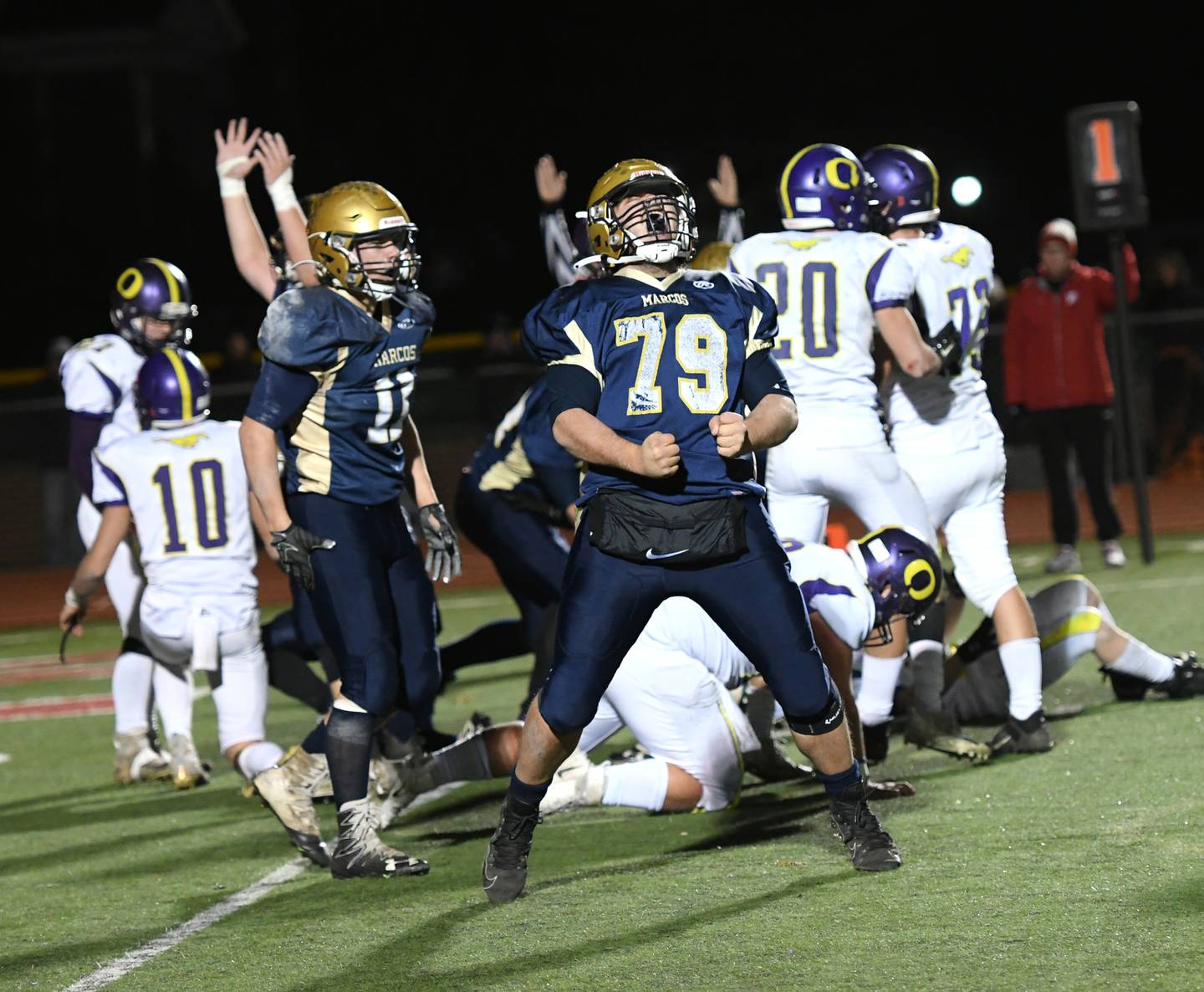 Polo's Cooper Blake celebratesa big defensive play for the Marcos in the fourth quarter at the 8-Man State Chapionship in Monmouth on Friday night. Polo beat Orangeville 12-7.