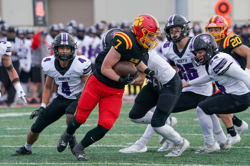 Batavia's Greyson Kelly (7) carries the ball against Downers Grove North during a class 7A quarterfinal playoff football game at Batavia High School on Saturday, Nov. 16, 2024.