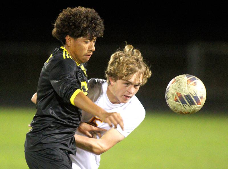 Harvard’s Bryan Gorostieta, left, battles Richmond-Burton’s Nate Larson in varsity soccer on Monday, Oct. 7, 2024, at Dan Horne Field on the campus of Harvard High School in Harvard.