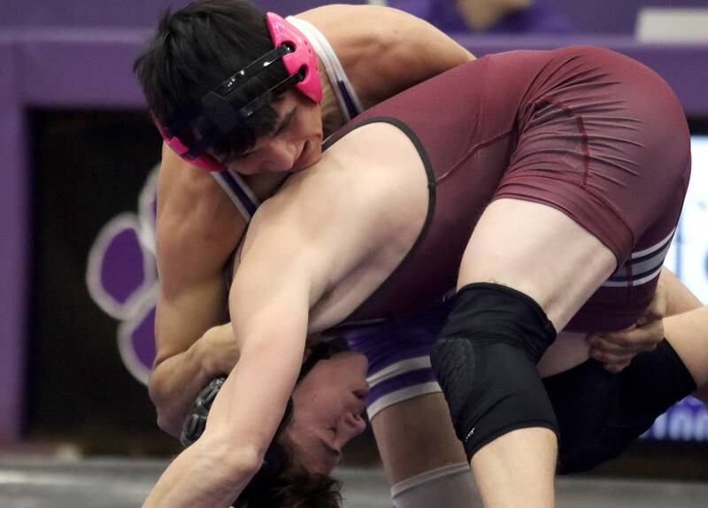 Hampshire’s Chris Napiorkowski, top, battles Prairie Ridge’s Tyler Cord at 150 pounds in varsity wrestling on Thursday, Dec. 5, 2024 at Hampshire High School in Hampshire.