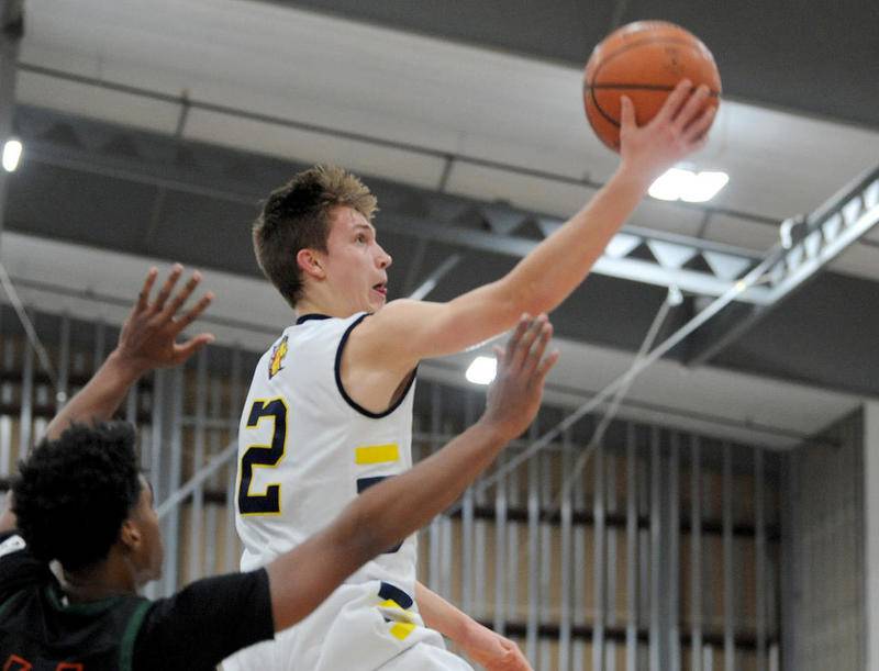 Yorkville's Jaden Schutt soars in for a layup last season. Schutt and other basketball players could be playing soon, after the IHSA announced that basketball could begin effective immediately after seven practices.