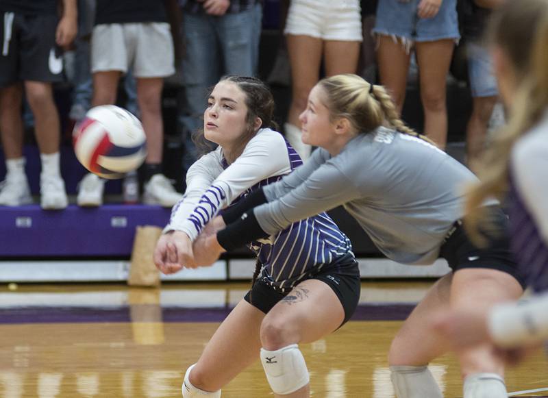 Dixon’s Joey Brumbly and Natalie Davidson come together while playing a shot against Alleman on Wednesday, Sept. 7, 2022.
