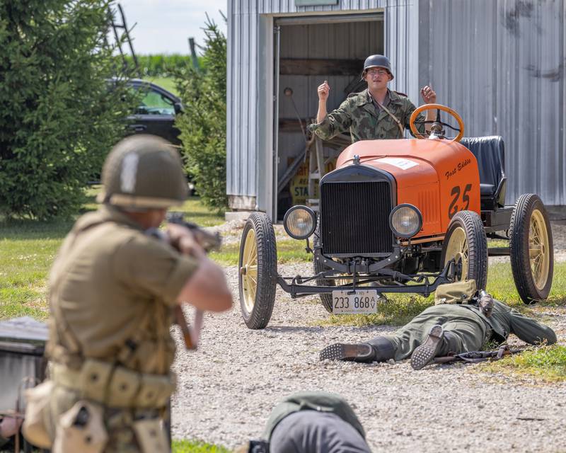 A German soldier surrenders to American forces during the town battle at the Ottawa Military Show on July 12, 2025 in rural Ottawa.