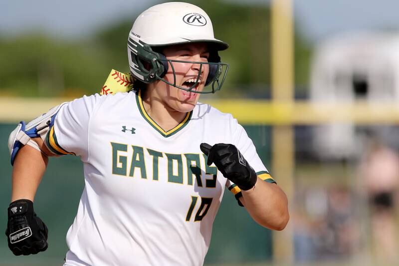 Crystal Lake South's Alexis Pupillo vocalizes her emotions as she prepares to round third base after hitting a homerun against Woodstock North during their IHSA Class 3A Softball regional championship at Crystal Lake South High School on Thursday, June 3, 2021 in Crystal Lake. Crystal Lake South won 8-0 through 7 innings of play.