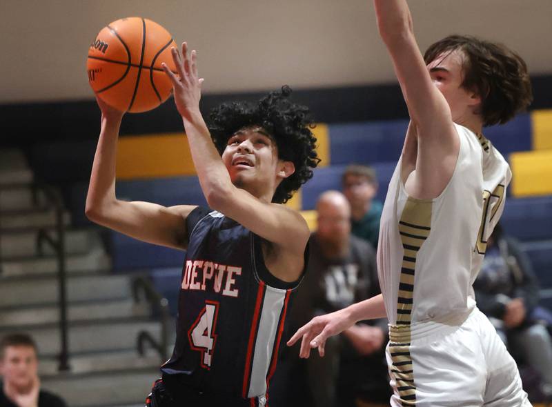 DePue’s Deigo Perez shoots in front of Hiawatha’s Austin Rylko during their game Tuesday, Jan. 20, 2026, at Hiawatha High School in Kirkland.
