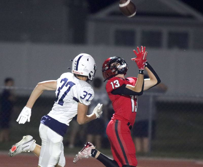 Huntley’s Kyle Ziebell hauls in a touchdown reception in front of Cary-Grove’s Matthew Maka in varsity football at Huntley High School in Huntley on Friday, Sept. 19, 2025.
