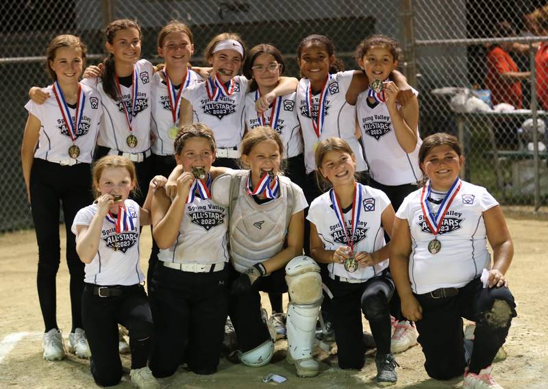Members of the Spring Valley 8-10 year-old softball pose for a photo after defeating Evergreen Park in the Minor League Softball State title game on Thursday, July 27, 2023 at St. Mary's Park in La Salle.