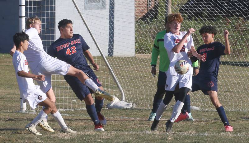 Earlville's Jeff Peterson and DePue/Hall's Sandro Aldana go after the ball during the Class 1A Regional quarterfinal game on Wednesday, Oct. 16, 2024 in DePue.