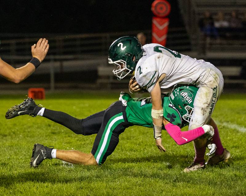 Brady Simek (22) of Seneca takes out Carson Riva (2) of St. Bede as he attempts to run ball on Friday, Oct. 10, 2025 at Seneca High School in Seneca.