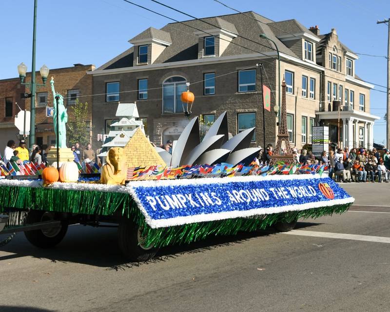 A "Pumpkins Around the World," the float marking this year's theme, travels through the Pumpkin Parade route on Sunday Oct. 28, 2024, downtown at the 63rd annual Sycamore Pumpkin Festival.