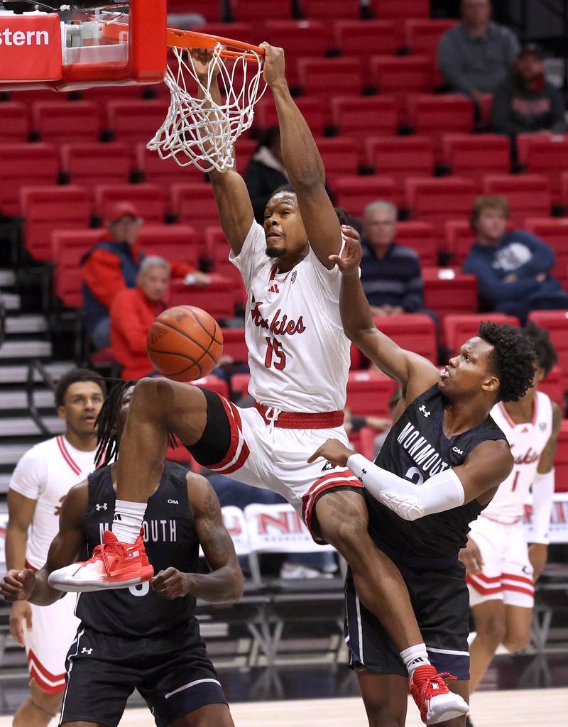 Northern Illinois' Ethan Butler gets a dunk off a rebound in front of Monmouth's Madison Durr during their game Tuesday, Nov. 12, 2024, in the Convocation Center at NIU in DeKalb.