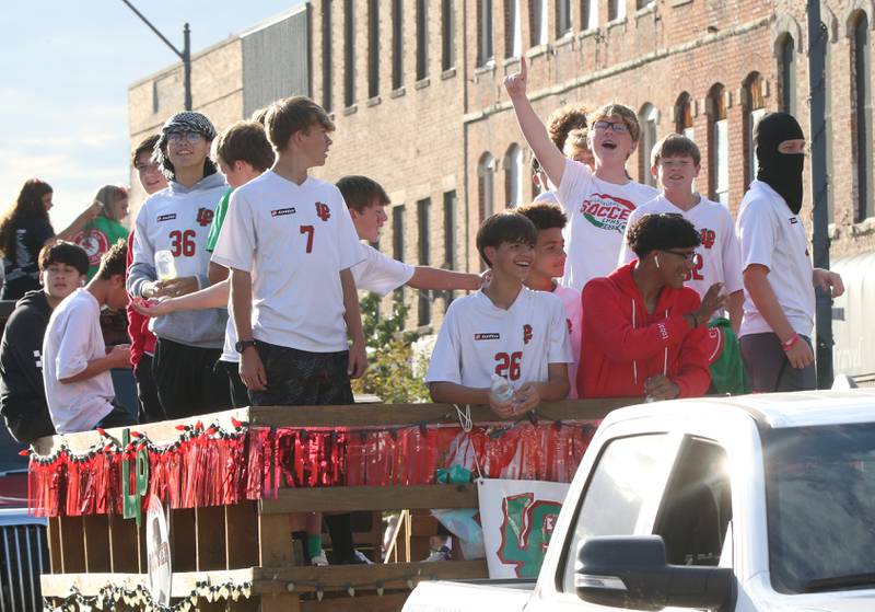 Members of the L-P boys soccer team ride during the L-P Homecoming parade on Thursday, Oct. 5, 2023 downtown La Salle.