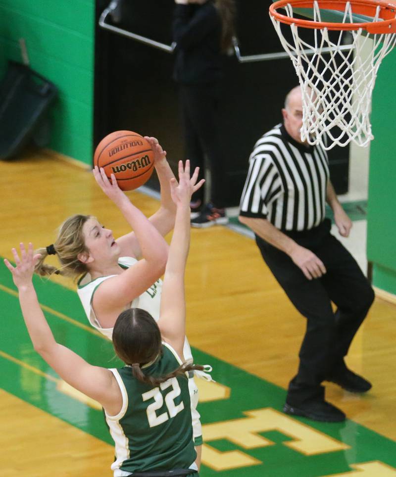 Seneca's Tessa Krull eyes the hoop as St. Bede's Ella Hermes defends on Monday, Jan. 29, 2024 at Seneca High School.