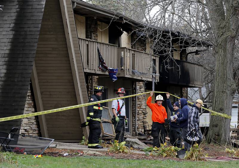 Woodstock firefighters outside the scene of a fatal fire on Wednesday, Nov. 13, 2024, in the 700 block of St. John’s Road in Woodstock. A fire the night before left one man dead, two in the hospital and more than 30 residents displaced, according to a Woodstock fire spokesman.