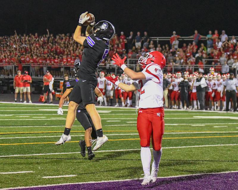 Downers Grove North's Max Troha, left, intercepts the ball that was intended for Hinsdale Central's Patrick Connors during the game on Friday Sept. 12, 2025, held at Downers Grove North High School.