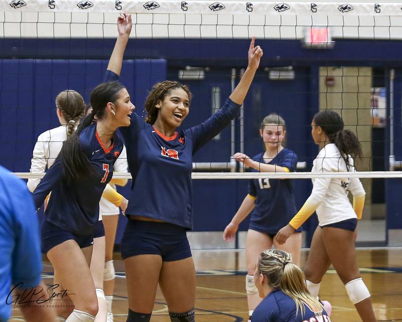 Oswego celebrates their win over Neuqua Valley in their Class 4A Regional Final volleyball match. Oct 30, 2025 in Plainfield.