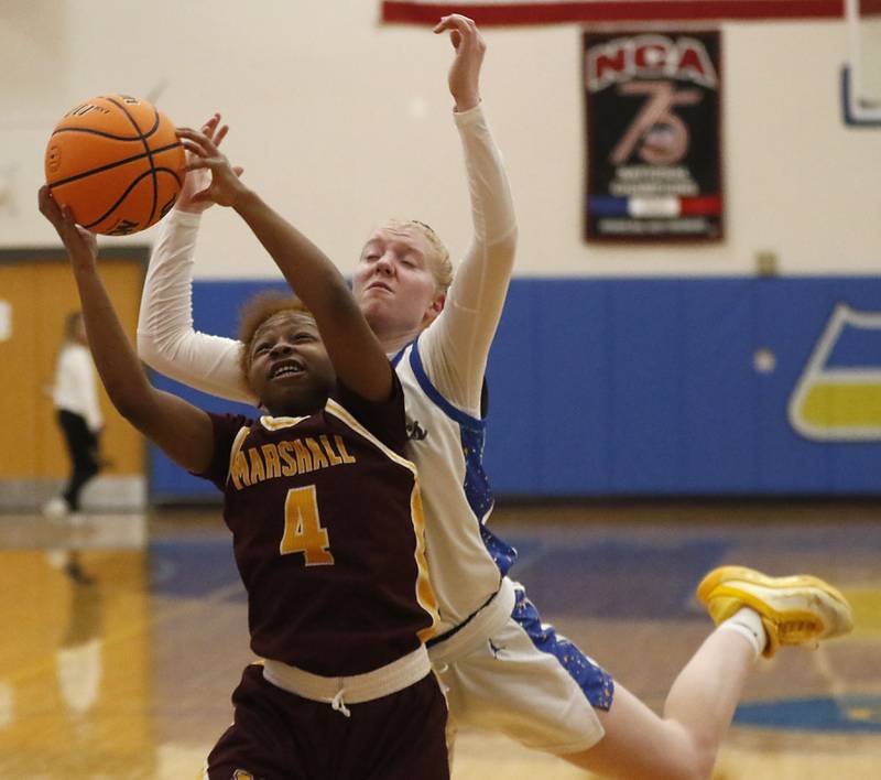 Chicago Marshall's Lanyla Sago grabs a rebound in front of Johnsburg's Casie Majercik during a IHSA Class 2A Johnsburg Sectional girls basketball semifinal game on Tuesday, February, 24, 2026, at Johnsburg High School.