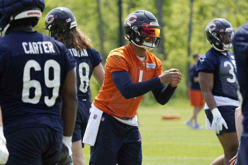 Chicago Bears quarterback Justin Fields works on the field during OTAs, Tuesday, May 23, 2023, in Lake Forest.