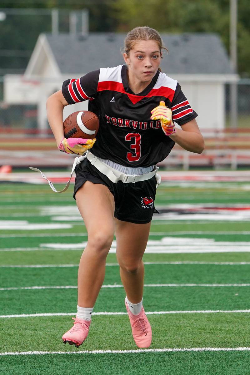 Yorkville's Annabel West (3) runs after the catch for a touchdown against Joliet Central during a flag football game at Yorkville High School on Monday, Sep 23, 2024.