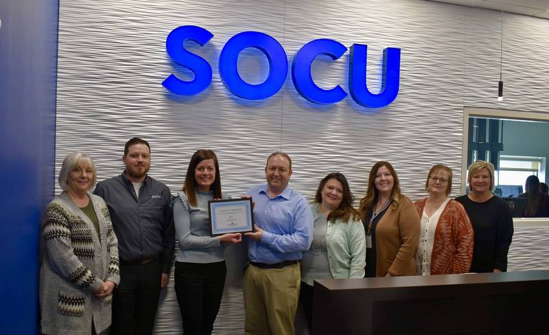 SOCU was named February 2023 business of the month by the Streator Chamber. Pictured are (left to right) Karen Karpati (Chamber board), Andrew Threadgill, Courtney Levy (Chamber executive director), Doug Patterson (SOCU CEO), Mayor Tara Bedei, Dana Stillwell (SOCU and Chamber board), Chris Cox and Mandi Gillman.