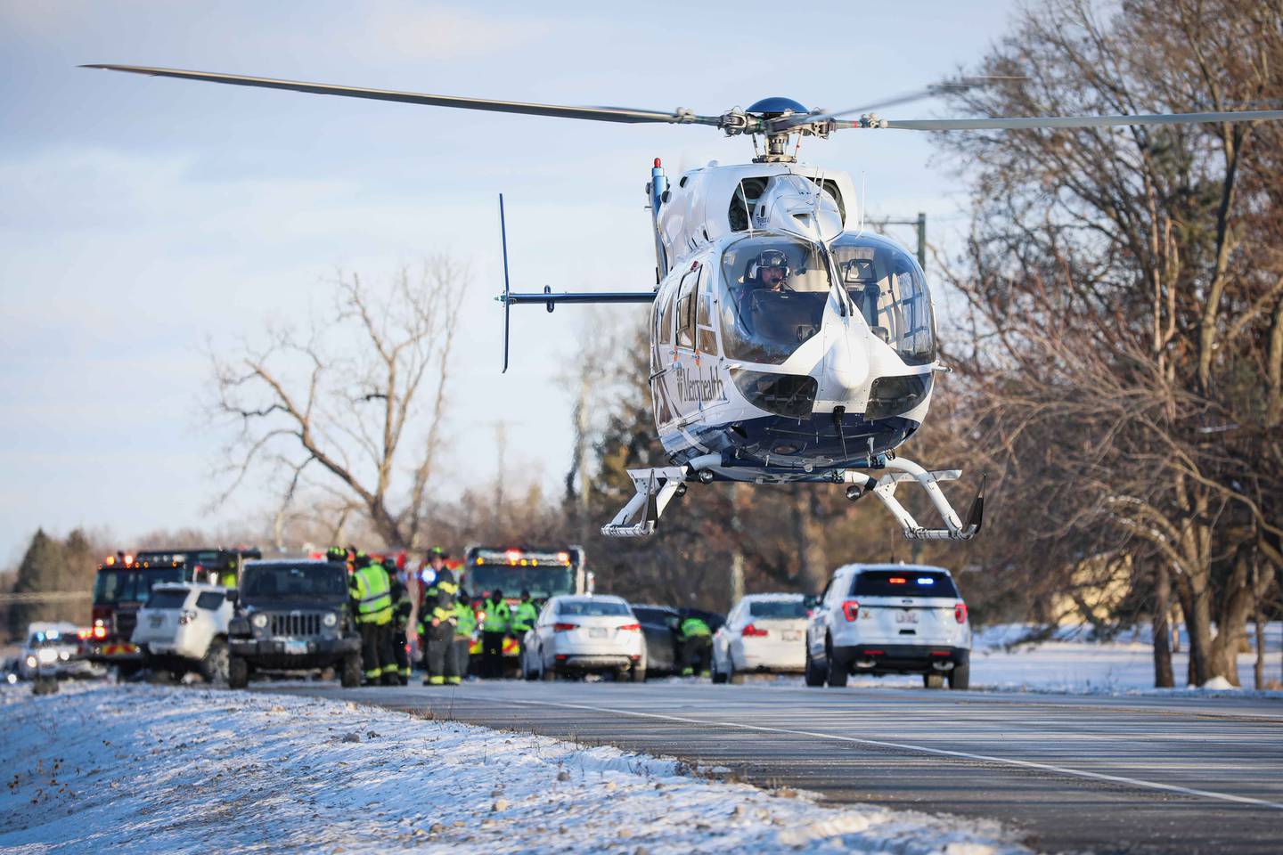 A medical helicopter responds to a crash on Sunday, Feb. 16, 2025, on Route 14 in Woodstock where one person died and five others were injured.