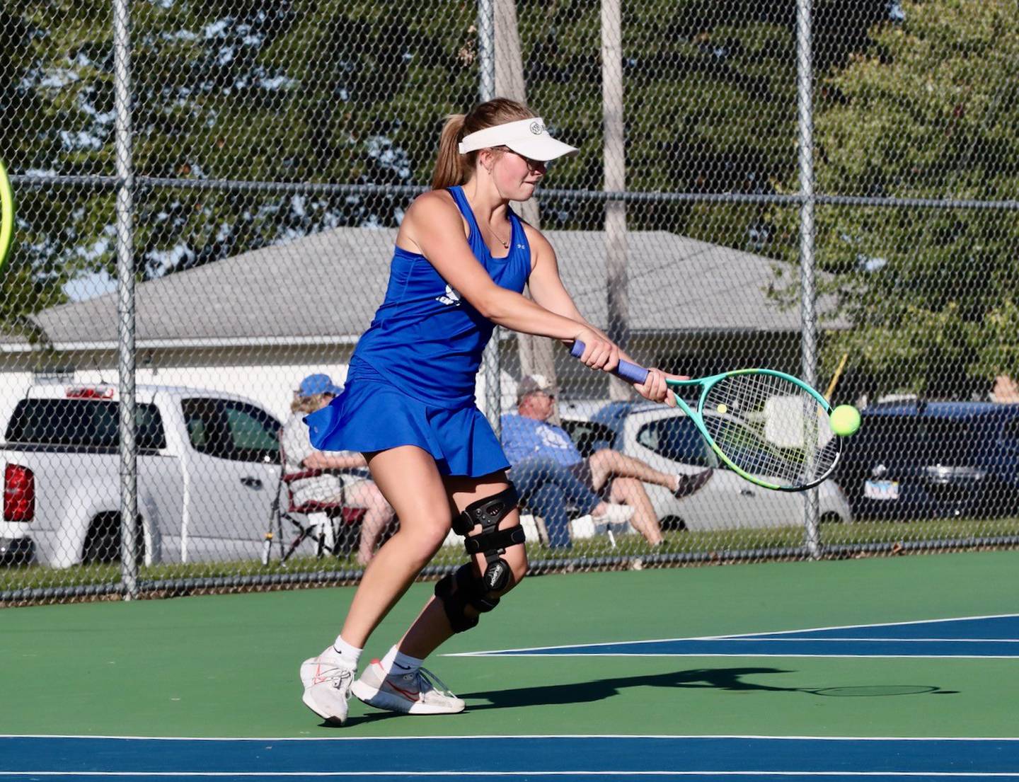 Nora Schneider makes a backhand return for Princeton Thursday against Peoria Christian. She teamed with Caitlin Meyer  for a 6-1, 6-0 win at No. 1 doubles.
