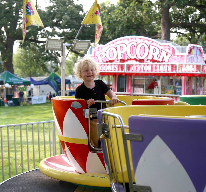 Two-year-old Oliver Orman of Genoa has fun on the tea cup ride at Elburn Days on Friday, Aug. 18, 2023 in Elburn.