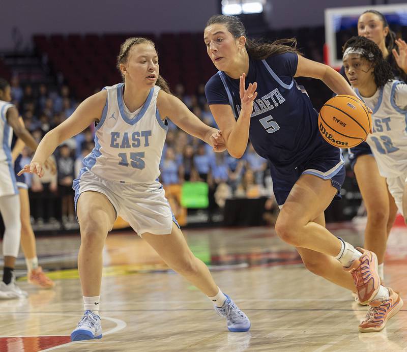 Nazareth's Sophia Towne drives to the hoop against Belleville East’s Vanessa Stacy Friday, March 6, 2026, in the Class 4A girls state semifinal game at CEFCU Arena at ISU.