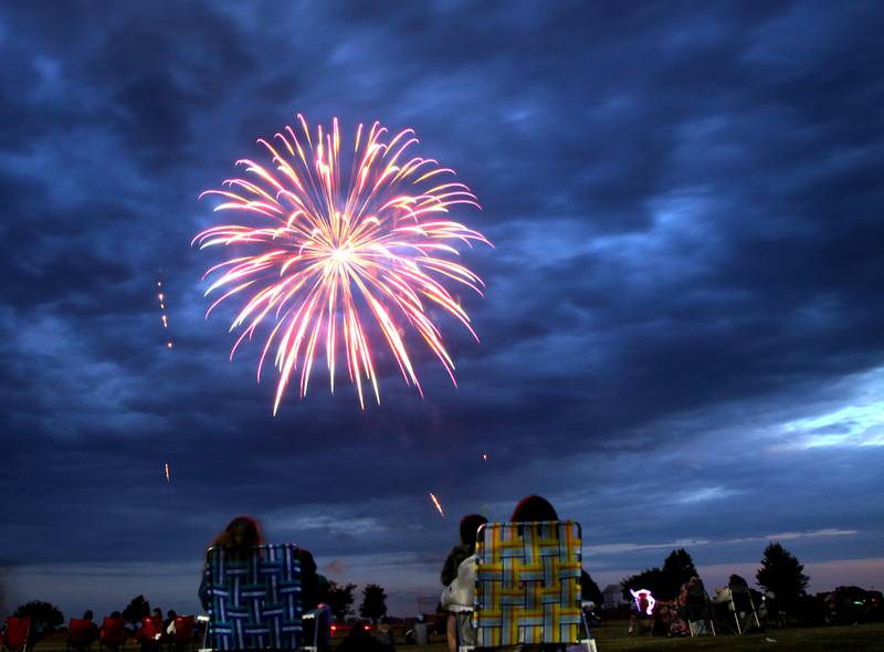 Fireworks color the sky Saturday, June 2, 2022, during the Red, White and Blue Food Truck FEASTival at Milky Way Park in Harvard.