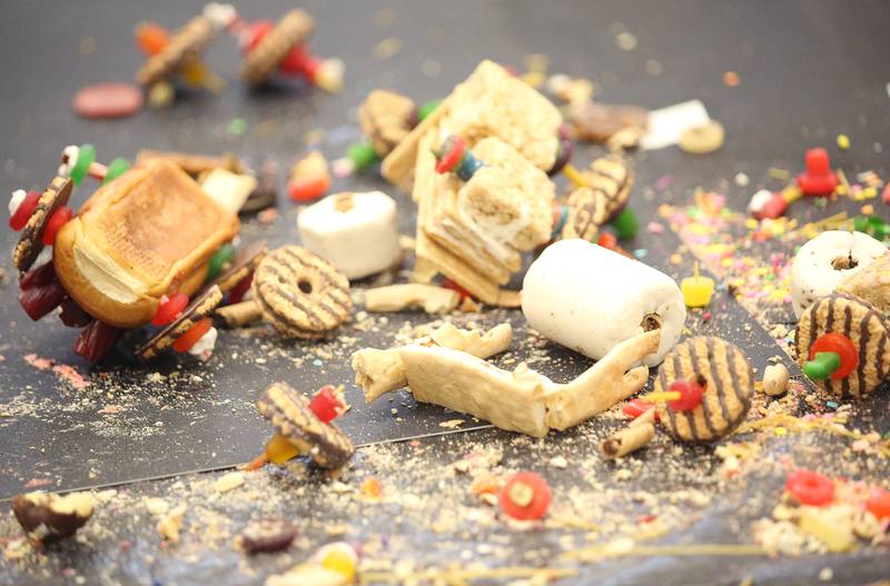 Pieces of food cover the floor at the finish line during the 29th annual Edible Car Contest on Wednesday, Feb. 26, 2025 in the cafeteria at Illinois Valley Community College.