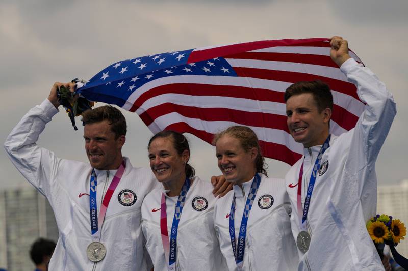 The United States team pose after winning the silver medal in the mixed relay triathlon at the 2020 Summer Olympics, Saturday, July 31, 2021, in Tokyo, Japan. (AP Photo/Francisco Seco)