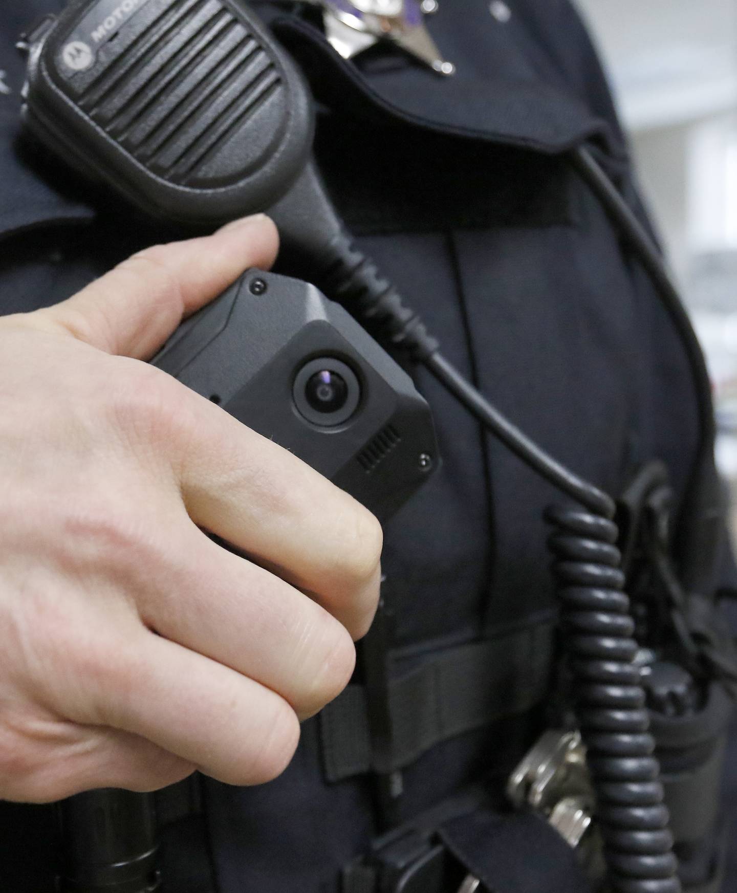 A police officer is seen with a body camera on Tuesday, Dec. 14, 2021.