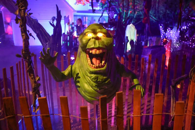 Slimer, from Ghostbusters, greets visitors at the newest Halloween display by Dave Appel HorrorProps, who made national attention with his “Stranger Things” display, on Thursday, Oct. 17, 2024 in Plainfield.