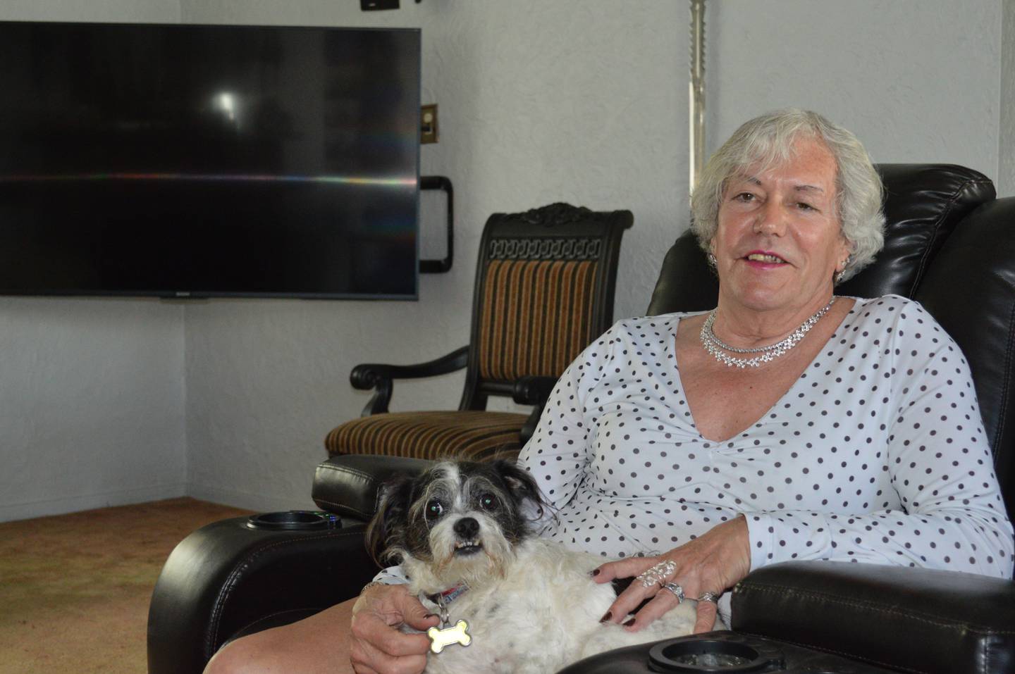 Danielle Aylward, the McHenry Township clerk who came out as a transgender woman to the public last week, poses for a portrait in her McHenry home with her dog Jojo, on Sunday, May 2, 2021.