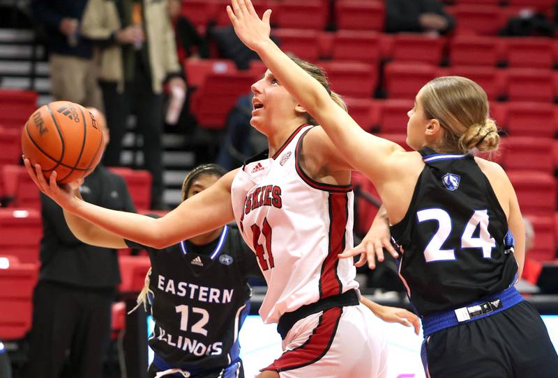 Northern Illinois' Brooke Blumenfeld gets to the basket ahead of Eastern Illinois' Ellie Buzzelle during their game Monday, Dec. 18, 2023, at the Convocation Center at NIU in DeKalb.