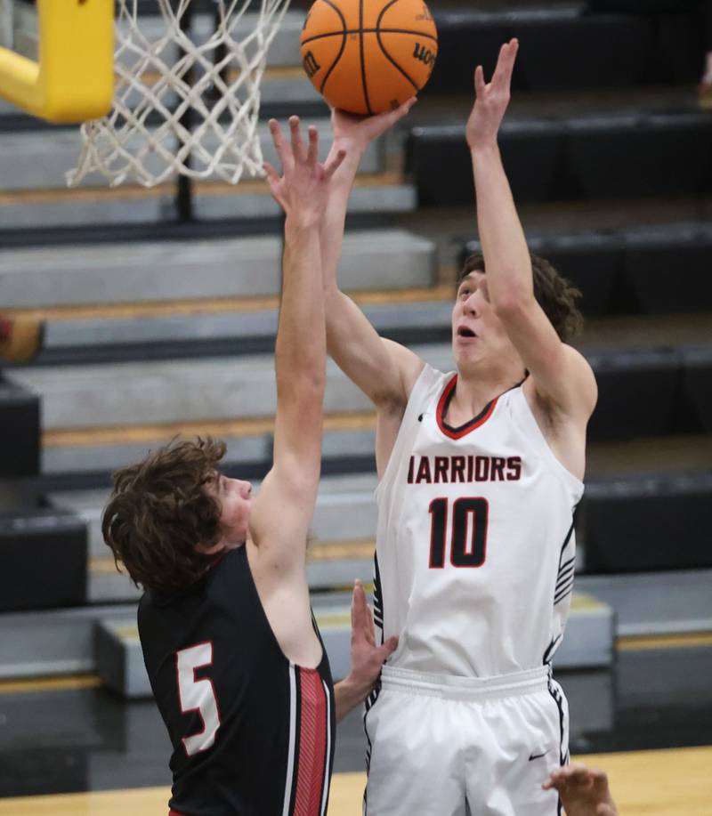 Woodland's Jaron Fullmer shoots a jump shot over Henry-Senachwine's Jacob Miller during the Tri-County Conference Tournament on Monday, Jan. 26, 2026 at Putnam County High School