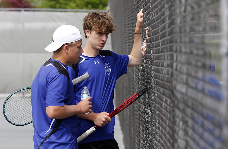 Geneva’s  Tyler Masoncup and Aaron Masoncup talk with their coach as they compete in the Class 2A Boys State Tennis Tournament on Thursday, May 29, 2025, at Palatine High School.
