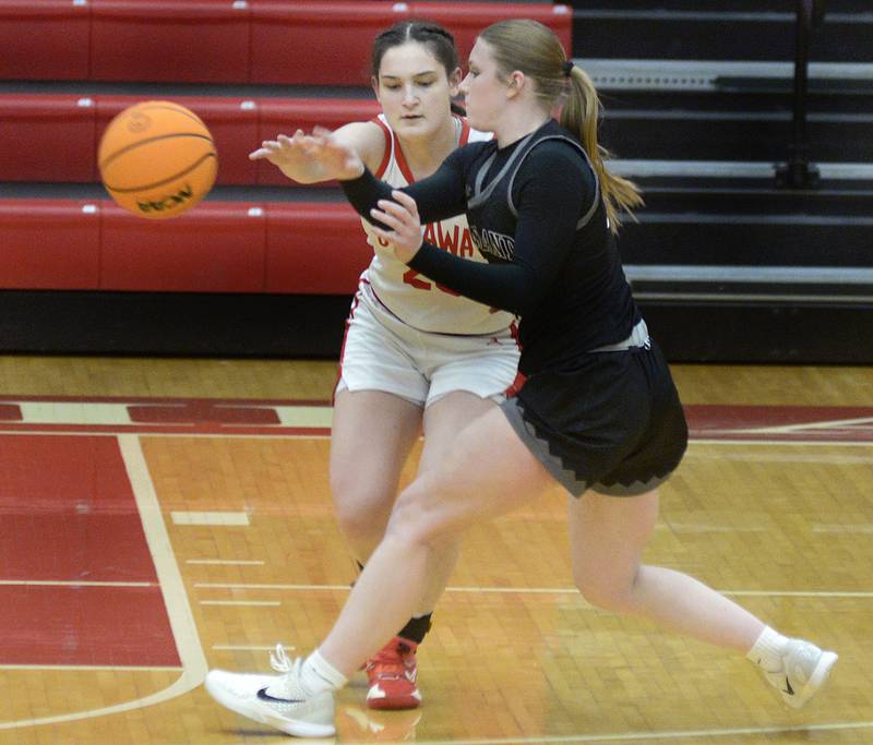 Ottawa's Mary Stisser knocks a pass away from Kaneland’s Kendra Brown in the 4th period Friday at Ottawa.