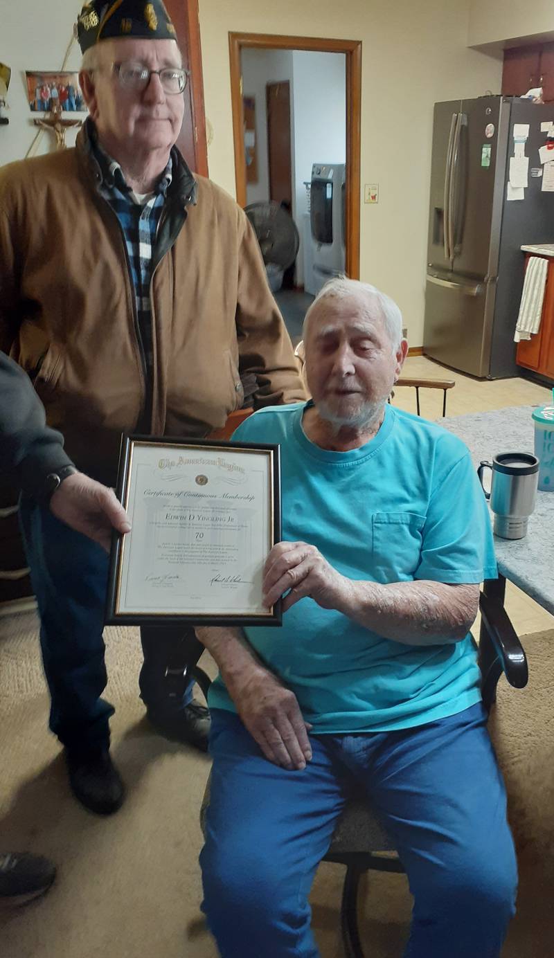 Dixon American Legion Post 12 member Bob Hoyle (left) presents an award to Legion member Ed Yingling Jr. The award was presented to Yingling to recognize 70 years of membership.