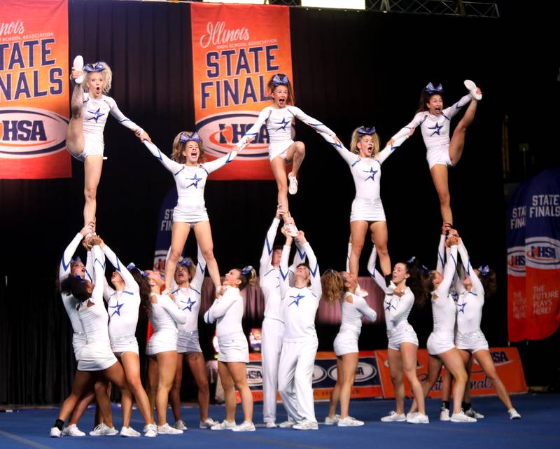 Members of the St. Charles North cheerleading team compete in the coed team division of the IHSA State Finals on Saturday, Feb. 8, 2025 at Grossinger Motors Arena in Bloomington.